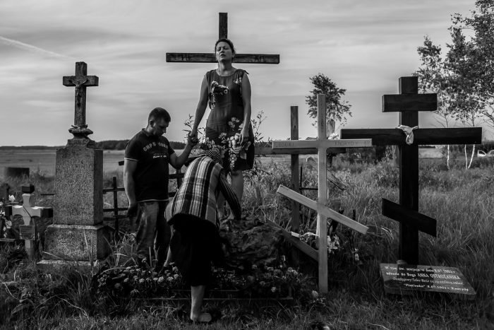 Whisperer Anna enters a young woman into a trance on the special stone where Holy Mary was seen by two small girls sixty years ago. Anna heals this woman from infertility while her husband holds her hand and prays.